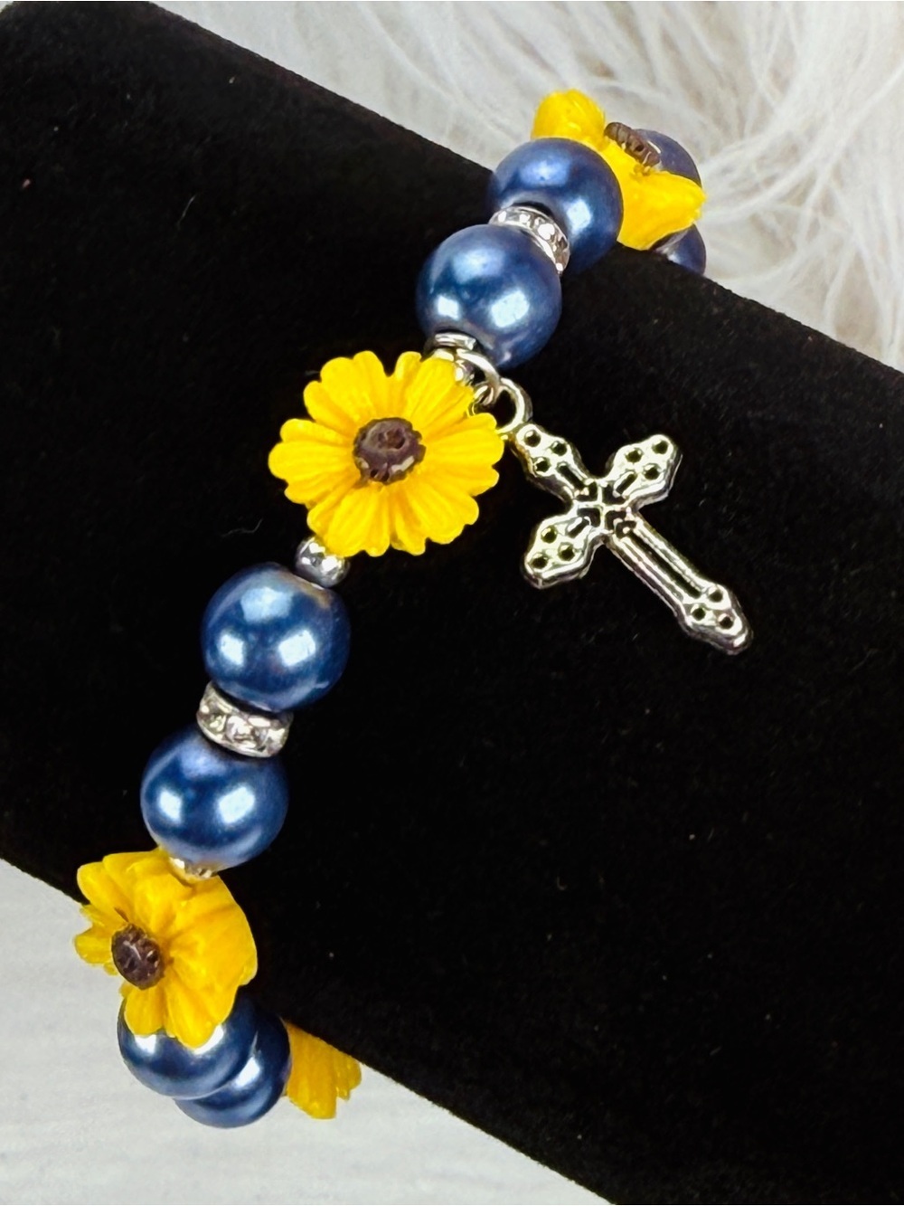 Pretty silvertone cross charm, yellow beaded, flower stretch bracelet